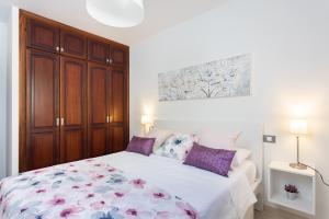 Postel nebo postele na pokoji v ubytování Home2Book Charming Apartment in Bajamar