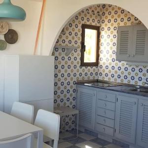 Kuhinja ili čajna kuhinja u objektu Formentera Es Pujols 2 camere vicinissimo alla spiaggia