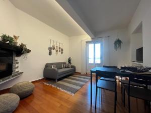 a living room with a couch and a table at Ascona: CÀ DAL DOLZ in Ascona +22 photos