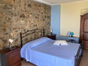 En eller flere senge i et værelse på B&B Relais da Clorinda