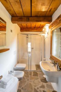 a bathroom with two sinks and a shower at Agriturismo Valliera in Castelmagno +213 photos
