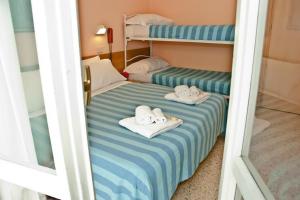 Rúm í herbergi á Hotel Staccoli