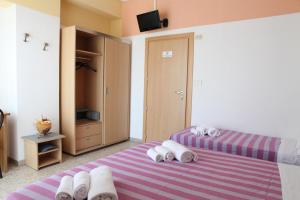 Rúm í herbergi á Hotel Staccoli