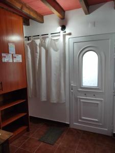 a room with a door and a window and a window at Di&Ana II - Alojamento Redondo in Redondo