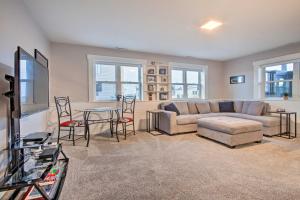 a living room with a couch and a table at Updated Helena Condo - Walk to Downtown Spots in Helena