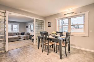 a dining room and living room with a table and chairs at Updated Helena Condo - Walk to Downtown Spots in Helena