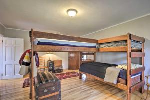 a bedroom with two bunk beds in a room at Remote Escape Riverside Home with Scenic Views 