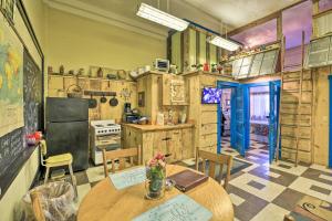 a kitchen with a table and chairs in a room at Unique ATV Apartment in Remodeled Schoolhouse in Gary