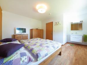 Ένα ή περισσότερα κρεβάτια σε δωμάτιο στο Holiday Home Runnimoos-1 by Interhome