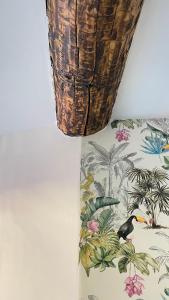 a vase with a bird on it next to a wall at CHEZ FIFI - studio 28m2 - hyper centre - wifi in Cassis