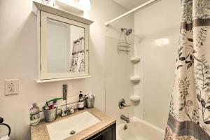 a white bathroom with a sink and a shower at Unique Old Schoolhouse ATV Retreat in WV! in Gary +34 photos