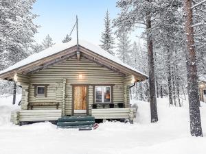 a log cabin in the snow at Holiday Home Saivontupa by Interhome in Ylikyro