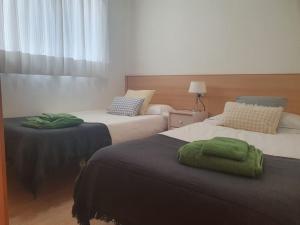 Postel nebo postele na pokoji v ubytování Apartaments Flamingo