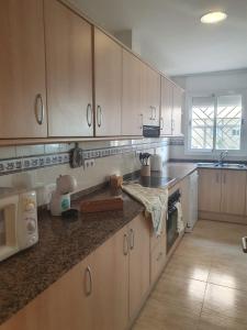 Kuchyň nebo kuchyňský kout v ubytování Apartaments Flamingo