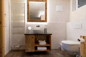 a bathroom with a sink and a mirror at Konradgut 11 - Ruhe und Aussicht auf 1140m in Sankt Lorenzen ob Murau