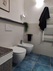 a bathroom with a white toilet and a sink at Casa dei giuggioli in Vernazza +10 photos