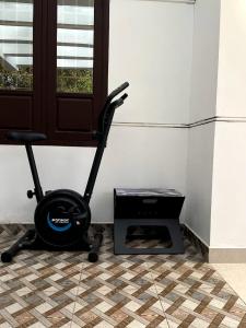 a room with a exercise bike next to a door at Sunny Daze in Cherai Beach