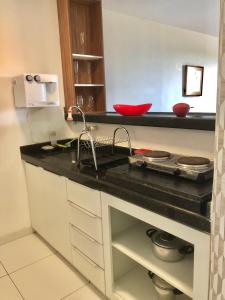 Virtuvė arba virtuvėlė apgyvendinimo įstaigoje Flat na Praia de Intermares