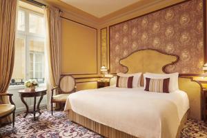 a bedroom with a large bed and a window at InterContinental Bordeaux Le Grand Hotel, an IHG Hotel in Bordeaux