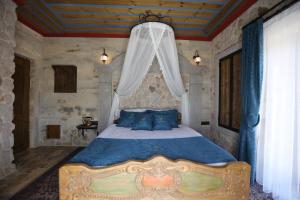 Postel nebo postele na pokoji v ubytování Akritis Cappadocia House