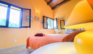 A bed or beds in a room at Scopello Home