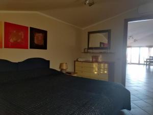 Postel nebo postele na pokoji v ubytování Terrazza sul Mare
