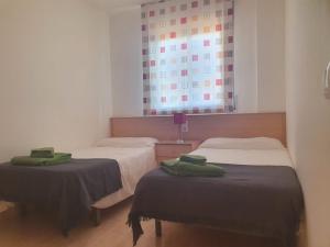 Postel nebo postele na pokoji v ubytování Apartaments Flamingo