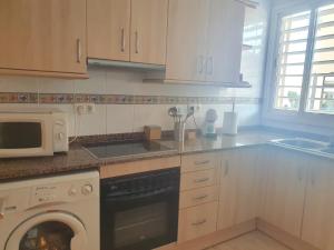 Kuchyň nebo kuchyňský kout v ubytování Apartaments Flamingo