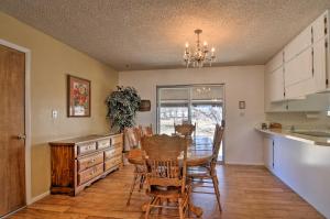 a kitchen and dining room with a table and chairs at Bryce Canyon Area House with Mountain Views! in Tropic