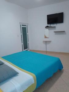 Postel nebo postele na pokoji v ubytování Residencia Jacarandas
