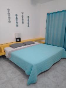 Postel nebo postele na pokoji v ubytování Residencia Jacarandas