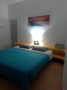 Postel nebo postele na pokoji v ubytování Residencia Jacarandas
