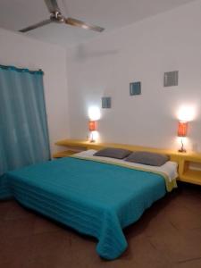 Postel nebo postele na pokoji v ubytování Residencia Jacarandas