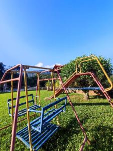 an empty roller coaster in a park at Quinta da Bela Vista in Caeté