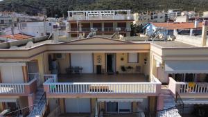 an aerial view of a house with a balcony at Nenas House in Iraklitsa