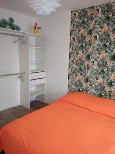 Posteľ alebo postele v izbe v ubytovaní Les petits gites