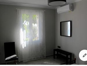 Televízia a/alebo spoločenská miestnosť v ubytovaní Dina’s house 2