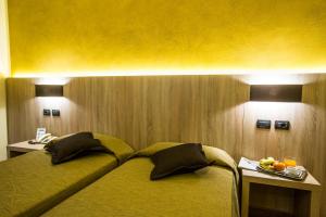Postel nebo postele na pokoji v ubytování Sangallo Park Hotel
