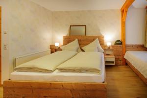 Ein Bett oder Betten in einem Zimmer der Unterkunft Arkadenhof Graf