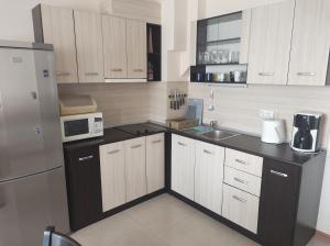 A kitchen or kitchenette at Sea Point Apartments