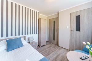Łóżko lub łóżka w pokoju w obiekcie Villa Rafałko