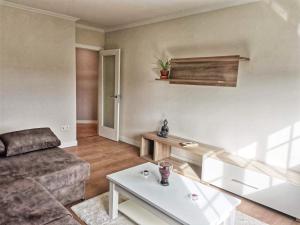 a living room with a couch and a coffee table at APTO. SANXURXO in Camariñas