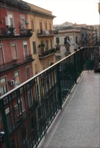 a balcony with a fence and some buildings at B&B Rial in Naples
