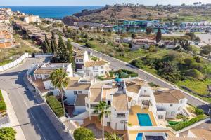 an aerial view of a villa with the ocean in the background at Villa Lemos by HelloVacations in Albufeira