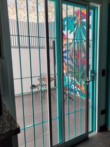 a sliding glass door with a view of a patio at Departamento en Villa Allende in Villa Allende