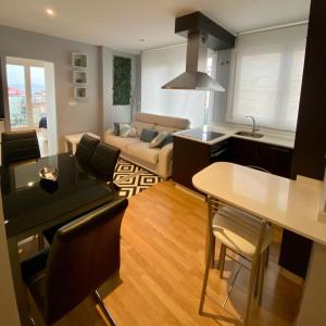 Posezení v ubytování Precioso apartamento en Sanxenxo + 13 fotografií
