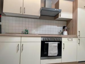 Kuchyň nebo kuchyňský kout v ubytování Apartment zur Wiege Anhalts