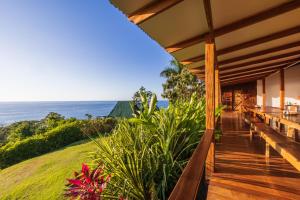 a house with a view of the ocean at Punta Marenco Lodge in Drake +32 photos