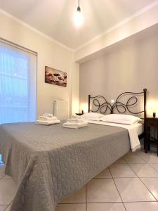 Ένα ή περισσότερα κρεβάτια σε δωμάτιο στο Angelland Luxury Suites