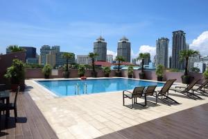 a swimming pool on the roof of a building at Value Hotel Thomson in Singapore